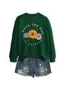 Detail of green crewneck sweatshirt with daisy print and Have The Day You Deserve text - Dark Green (White Print)