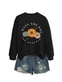 Close-up of printed sweatshirt featuring daisy patterns and denim shorts with distressed details - Black (White Letters)