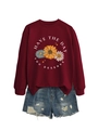 Detail of burgundy sunflower sweatshirt with HAVE THE DAY YOU DESERVE text and denim shorts - Wine Red (White Letters)