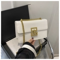 Detail of white leather crossbody bag with golden geometric lock and chain strap - White