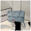 Detail of light blue quilted denim envelope bag with gold chain and crossbody strap - Light Blue