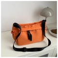 Detail of bright orange oxford cloth shoulder bag with black drawstring and wide strap - Orange