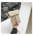 Detail of hand-woven straw mini bag with white leather tassels and gold magnetic closure - Off White
