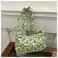 Dettaglio della borsa floreale verde con stampe di margherite e manico con effetto arricciato - Verde