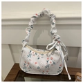 Dettaglio borsa floreale con manico arricciato e fiocco decorativo sul lato della borsa - Grigio