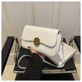 Detail of white leather crossbody bag with vintage gold buckle and slim shoulder strap - White