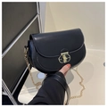 Detail of elegant black semi-circle saddle bag with gold metal lock and chain strap - Black