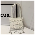Detail of white leather bucket bag with bow accents and silver beaded chain strap - White
