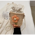 Detail of straw bucket bag with orange flower decoration and pearl bead strap - Khaki