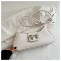 Detail of a creamy white crescent shoulder bag with a silver butterfly bow on smooth leather - White