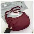 Burgundy nylon crescent dumpling bag with wide adjustable strap and zipper detail - Red