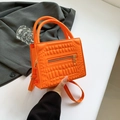 Bright orange crocodile embossed handbag with gold zipper detail and adjustable strap - Orange