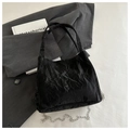 Detail of black wrinkled texture handbag with metallic silver chain and handles - Black