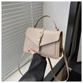 Detailed view of beige leather crossbody bag with elegant gold buckle and top handle - Khaki