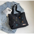 Black canvas tote bag with colorful embroidery and matching round coin purse accessory - Black