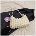 Macro shot of white bubble textured fabric and braided rope straps on casual shoulder bag - White