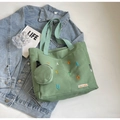 Light green canvas tote bag with colorful embroidery and matching mini round pouch - Green