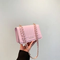 Minimalist light pink quilted chain crossbody bag with golden strap and fashion text - Pink
