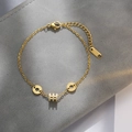 Bracciale in acciaio al titanio con ciondolo a cilindro dorato e anelli con numeri romani - Bracciale Little Waist Oro (TS004)