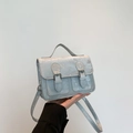 Mini Cambridge style crossbody bag in light blue with shimmering glitter finish - Silver