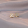 Elegant gold clover stud earrings with full diamond pavé on grey satin background - Gold Pave Clover Stud Earrings (E108)