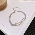 Minimalistisches silbernes doppellagiges Kreuzarmband mit verstellbarem Verschluss - Doppellagiges Kreuz-Armband (TS 0065)