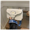 Detail of off-white canvas small square bag with blue trim and wide branded strap - White
