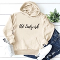 Detail of apricot hooded sweatshirt with Old Lady-ish text print and ribbed cuffs - Sand (Black Font)