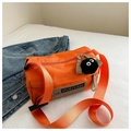 Detail of orange oxford barrel bag with black plush charm and adjustable shoulder strap - With Pendant / Orange