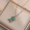 Titanium steel necklace with green zircon dinosaur pendant on a silk jewelry box - Steel Color Dinosaur Necklace