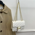 White quilted rectangular shoulder bag with V-shaped texture and gold chain strap - White