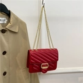 Elegant red quilted leather shoulder bag with golden chain strap and metal buckle - Red