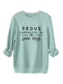 Close-up of mint green fleece sweatshirt with Proud Supporter of Snow Days print - Light Green (Black Print)