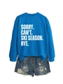 Close-up of SORRY CAN'T SKI SEASON text on blue sweatshirt and distressed denim shorts - Lake Blue (White Font)