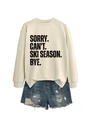 Detail view of cream sweatshirt with SORRY CAN'T SKI SEASON slogan and frayed denim shorts - Sand (Black Font)