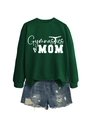 Flat lay of a green Gymnastics MOM sweatshirt paired with frayed denim shorts - Dark Green (White Font)