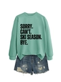 Close-up of mint green sweatshirt with black text print and distressed denim shorts - Light Green (Black Print)