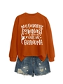 Flat lay of an orange gymnast slogan sweatshirt paired with ripped denim shorts - Burnt Orange (White Font)