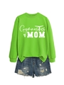 Flat lay of bright green Gymnastics MOM sweatshirt paired with distressed denim shorts - Neon Green (White Font)