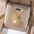 Elegant gold flower necklace with white pearl and pink zircon petals on silk - Pink Shell Pearl Rotating Necklace (X0069-2)