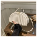 White semi-circular crossbody bag with V-shaped quilting and gold hardware handles - White