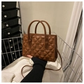 Brown faux leather crossbody bag with clover embossed pattern and cylinder handle - Brown