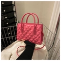 Pink crossbody bag with embossed four-leaf clover pattern and stylish hand straps - Pink