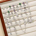 Celestial star and moon earring collection with colorful zircons in a jewelry box - Star and Moon Style (EGD0058)