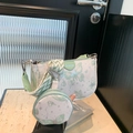 Ink style crossbody bag with green butterflies, matching round pouch and woven strap - Green