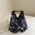Black skull and floral nylon tote bag with LOVE printed straps in a goth streetwear style - Blue
