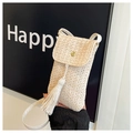 Detail of handmade beige straw phone bag featuring gold snap buckle and long tassels - White