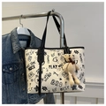 Detail of white PU tote bag with black graffiti print and cute beige bear pendant - With Pendant / Black