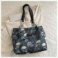 Detail of gothic floral skull print on black tote bag with silver chain metal rings - Green