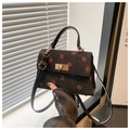 Detail of strawberry embroidery on black corduroy crossbody bag with golden turn-lock - Black (Strawberry Print)